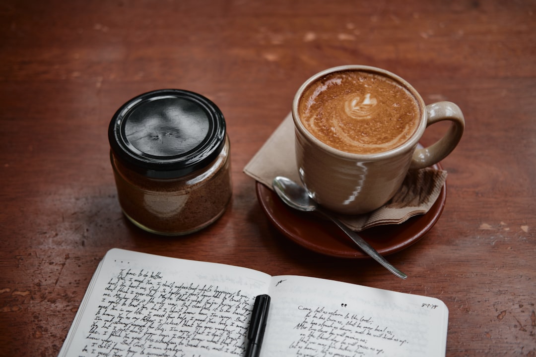 Journal and coffee representing mindful financial reflection