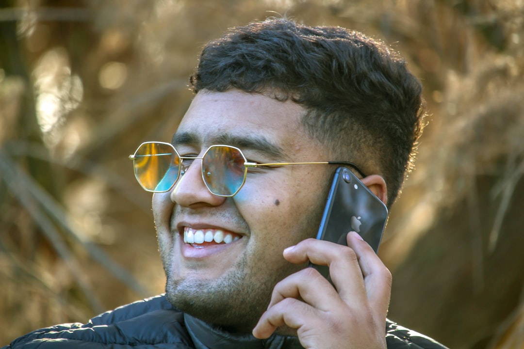 Person looking empowered and happy with a smartphone, not shopping