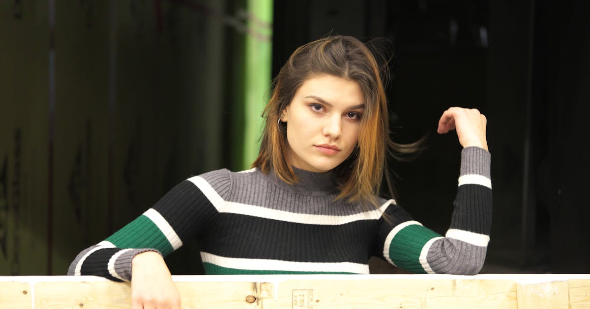 Young woman with a confident expression looking toward the future