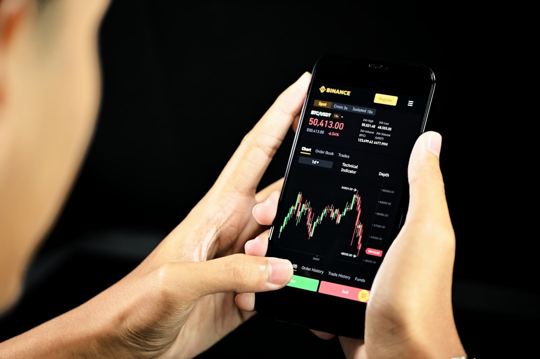 Person using financial wellness app on phone