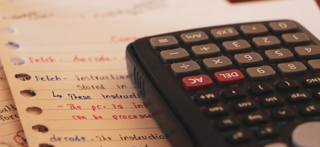 Calculator on financial documents representing budget planning