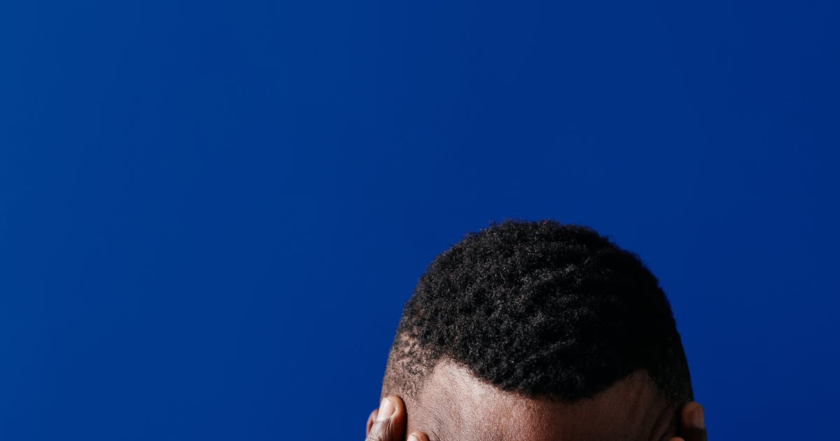 Person stressed with hands on head