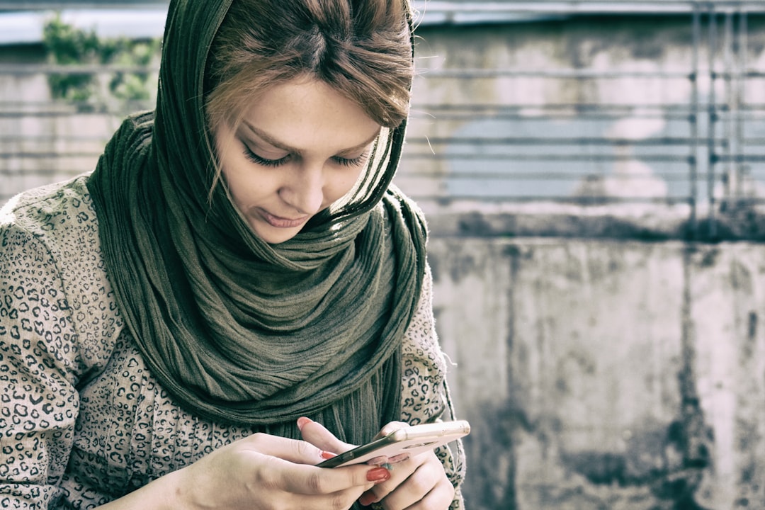 Confident person using smartphone app to manage their finances