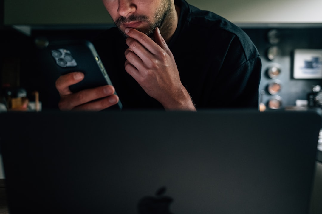 Person looking shocked at their phone showing subscription charges